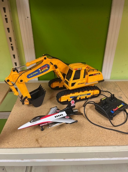 Die cast Matco Tool die cast air plane and battery operated backhoe