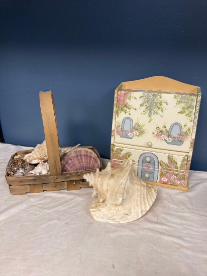 Basket of decorative shells and a sweet jewelry box