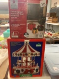 Lighted Christmas decorative gift boxes and a 16 inch Christmas Carousel
