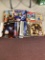 Game Informer magazines plus one Nintendo Power and a Pokemon album
