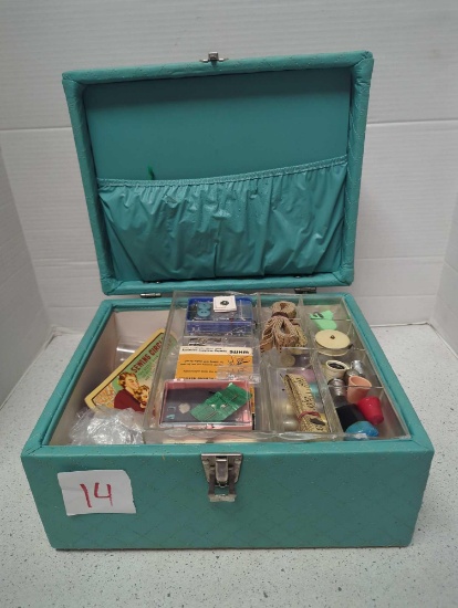 Vintage sewing box full of sewing needles, thread, buttons, scissors, thimbles