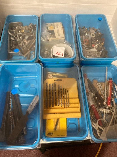 Containers full of drill bits screws small tools etc