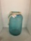 water jug 17 inches tall glass cylinder filled with Easter eggs 24 inches tall