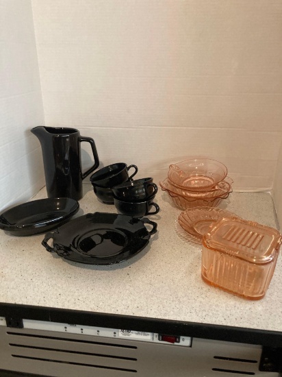 Black dinnerware and pink depression