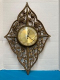 Mid century Syroco clock has section with crack