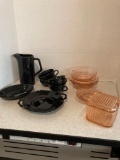 Black dinnerware and pink depression