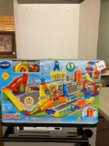 New in box Vtech speedway set