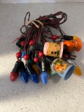 Vintage Noma Christmas lights with winter and nursery rhyme caps