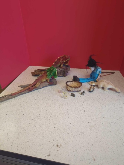 hand carved wooden lizards on branch, wooden puppet, small figurines