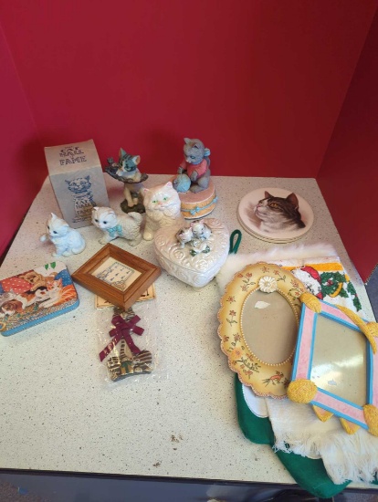 Cat figurines, trivets, picture frames, towel and stocking