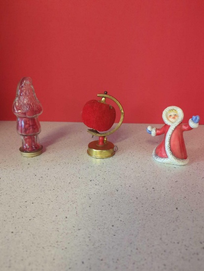 Santa glass candy container, goebel winter kid, globe cushion with tape measure