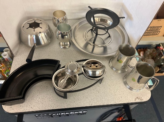 age metal cups and glass bottle cups and cooking equipment