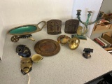 vintage metal masks, plate, bell, candle stand, wheelbarrow and cast iron praying decor