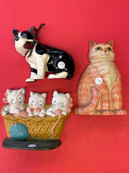 three cast iron, doorstops, cats and dogs