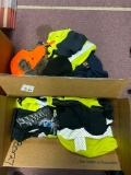 high visibility clothing, work clothing, hats, and many pairs of gloves