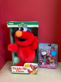 Tickle Me Elmo and Gabby?s dollhouse
