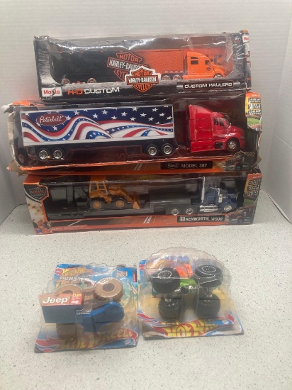 New Die cast trucks and two Hot wheels monster truck
