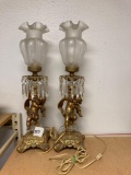 pair of gild brass cherub Putti Lamps with ruffled glass shades