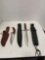Three knives or daggers in sheaths