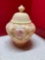Hand painted, signed Fenton Burmese jar with lid