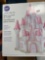 Large lot of baking supplies including glass cake stand, sheet pans, cake decorations and decorating