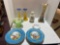 large flower ceramic pitcher, yellow to blue candle holders, blue scene pedestal plates and green