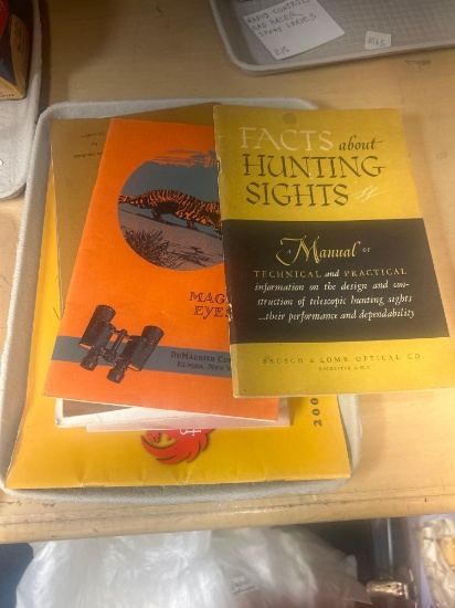 vintage hunting equipment, booklets hunting scopes, binoculars, Mossberg marksmanship ruger, old gun