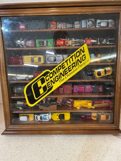 Hot Wheel and Hot Wheel type cars in display case
