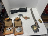 chain belt, Harley Davidson belt buckles, and binoculars