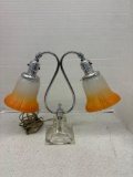 Art nouveau double arm lamp, etched glass bottom, orange frosted shades