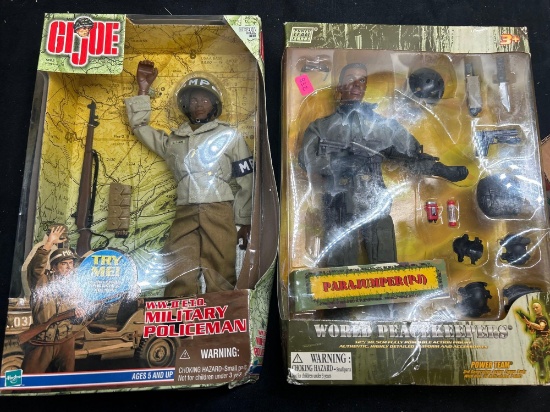 two G.I. Joe action figures in boxes