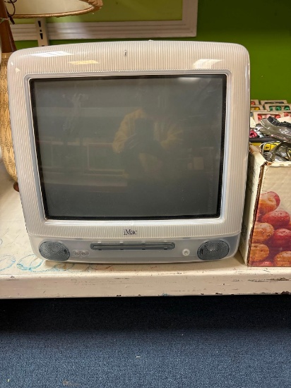 Older apple iMac with keyboard and accessories