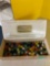 Vintage marbles in fruitcake box