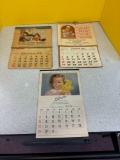 Three vintage calendars 1950, 1951, 1964