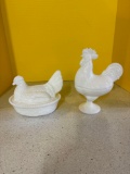Rooster and hen on nest