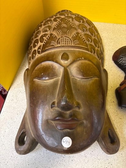 Hanging Face sculptures