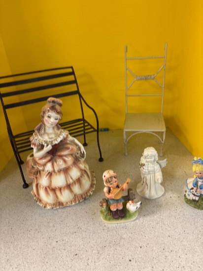 porcelain figurine, metal chairs, paperback books