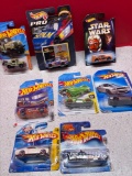 Eight hot wheel cars in packages