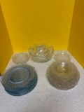 Clear glass plates and bowls, including one set of etched glass plates
