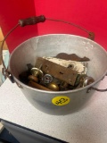 Metal pot filled with vintage hardware, knobs, mortise