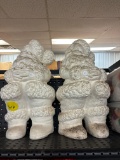 Pair of concrete Santa Claus figures