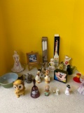 Porcelain figurines, candles, miniature artwork