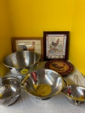 Two rooster pictures, a rooster plate, and some strainers