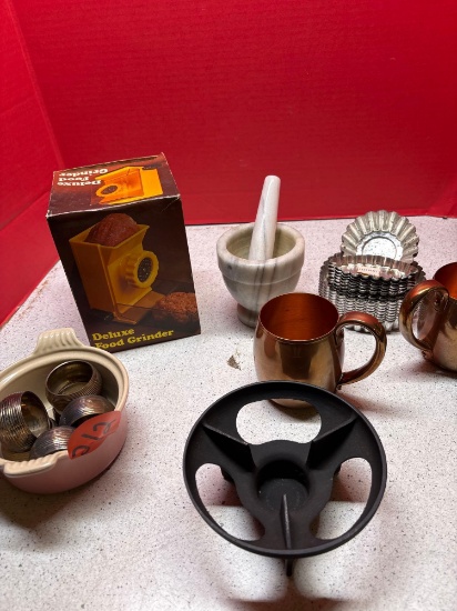 copper cups, food, grinder, napkin, rings