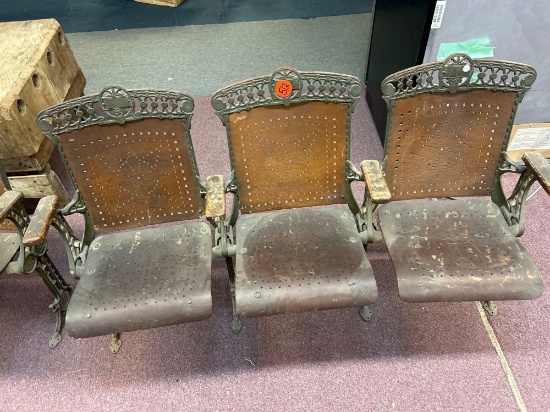 three vintage wooden cast-iron folding theater chairs