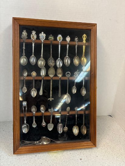 27 Souvenir spoons in wooden hanging case