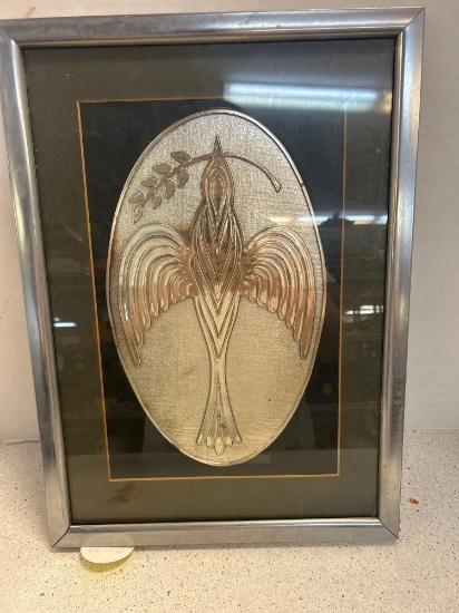 Silver bird of peace in frame