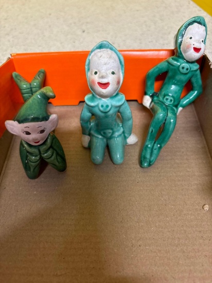 Three ceramic Christmas pixie elves