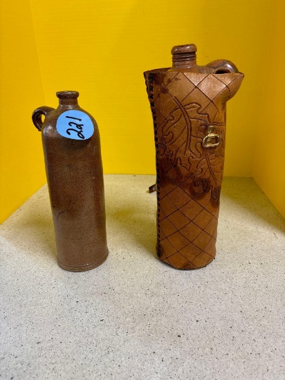 Two crock jacks one in leather Case