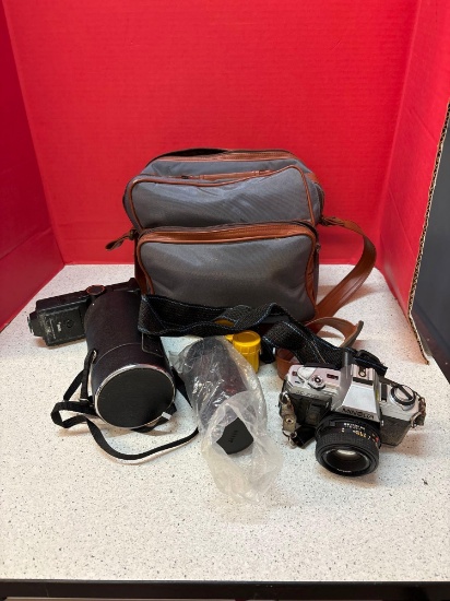 Minolta X-370 SLR Camera with extra lenses and accessories